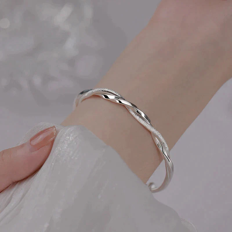 Twisted Silver Bangle Bracelet | Elegant & Timeless Design